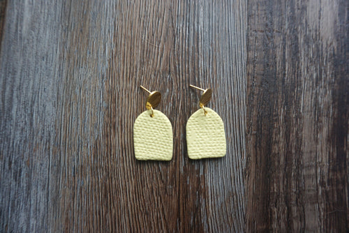 Pastel yellow semi-oval patterned earrings