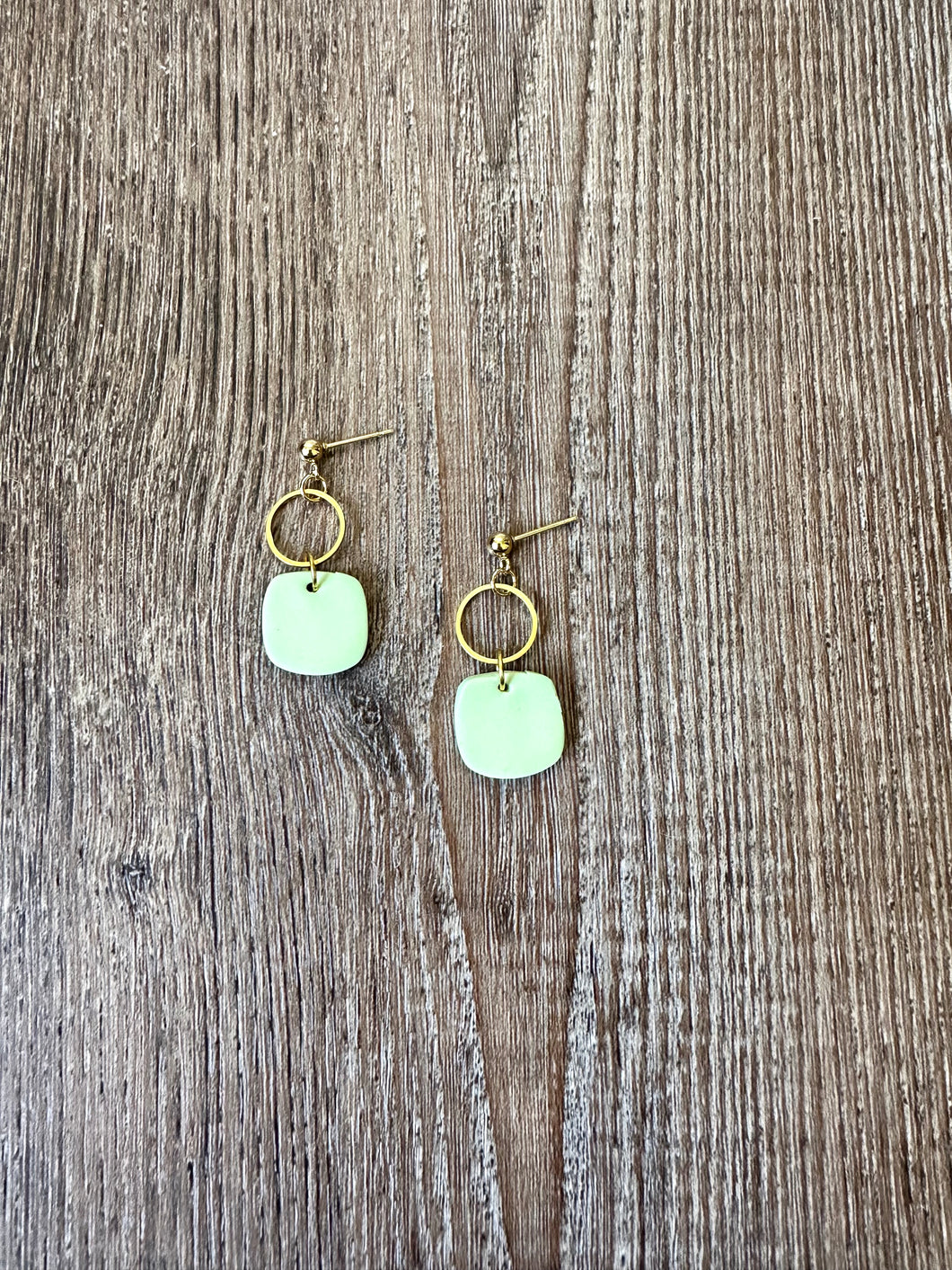 Dainty lime green square earrings.