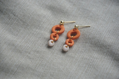 Orange and pink triple-tiered dangles