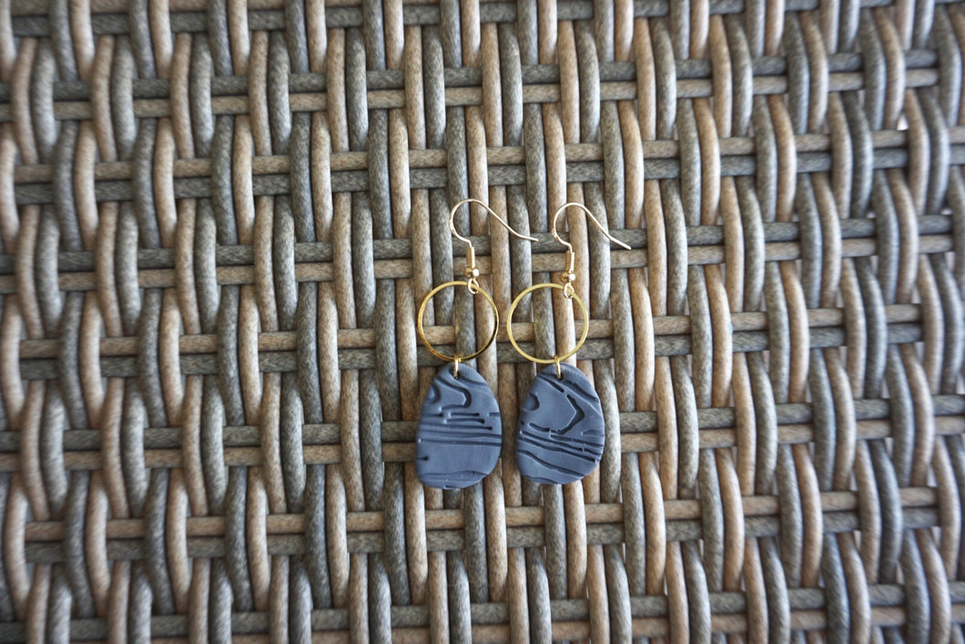 Deep blue wooden patterned oval earrings