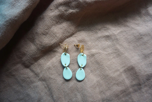 Sky blue circular earrings